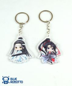 two key chains with anime characters on them