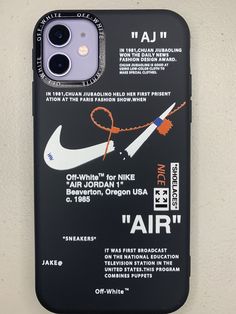 an iphone case with a pair of scissors attached to it's back and side