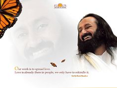 a man with a beard smiling next to a butterfly