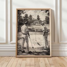 two men are playing golf in front of a large painting on the wall with a wooden frame