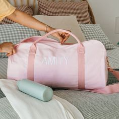 Paint a pretty picture in your imagination of how pleased your loved one will be when they receive this personalised, practical and pleasingly presentable pink canvas duffle bag. Roomy enough for everything you could need for a sleepover, day at the dance studio or fun weekend away, the pink duffle is complemented by a gorgeous rose gold zip to keep everything safe and sound. The ultimate travel accessory features sturdy cotton webbing carry handles making it easy to pick up and pop in the back of the car or even overhead compartment on a plane, plus a detachable and adjustable shoulder strap for those times you need to carry it that little bit further Make this a gift they’ll truly love for many travels trips to come with their own name or initials stylishly embroidered into the side, for Pink Rectangular Duffle Bag For School, Everyday Pink Rectangular Duffle Bag, Pink Rectangular Travel Bag As Gift, Pink Rectangular Travel Bag For Gift, Pink Cotton Canvas School Bag, Pink Gift Wrap, Pink Duffle Bag, Canvas Duffle Bag, Pink Canvas