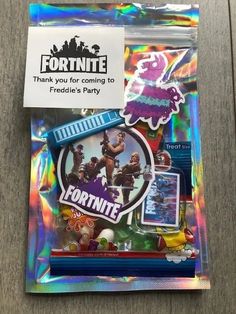 a package of stickers with the fortnite logo on it and some other items