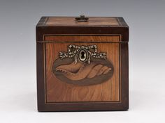 a wooden box with an image of a woman's hand on it