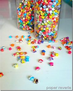 two glass jars filled with different colored candies