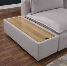 a couch with a wooden tray underneath it