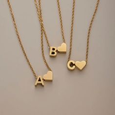 Spell it out. The traditional initial necklace gets an elegant upgrade with a simple heart symbol - no chain stack is complete without it.Made with waterproof stainless steel, you never need to worry about fading or tarnishing jewelry ever again. Waterproof & tarnish-free Stainless steel 14K gold-plated Length: 17.7in (+ 3in adjustable) Hypoallergenic, lead & nickel free If you aren't in LOVE with your purchase, please let us know within 30 days of receiving your item, and you'll receive a stress-free refund. Chain Stack, M Letter, Heart Symbol, Bubble Bag, Letter V, Letter R, Halloween Sale, Letter B, Love Letter