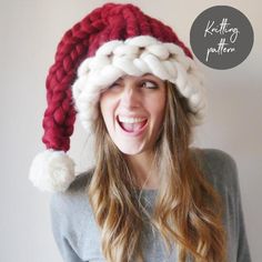 a woman wearing a red and white knitted santa hat