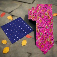 This silk necktie, featuring vibrant shades of pink, orange, and green with a unique abstract watercolor pattern, brings a fresh and artistic touch to any outfit. The flowing, painterly design of the tie creates a lively yet sophisticated look, perfect for those who enjoy adding a bit of color and creativity to their wardrobe. The combination of warm and cool tones allows this tie to stand out, while still maintaining a refined and tasteful appearance. Dress Shirts: White dress shirt – A classic Brown Bow Tie, Grey Bow Tie, Yellow Bow Tie, Purple Bow Tie, Polka Dot Bow Tie, Kids Ties, Green Bow Tie, White Bow Tie, Plaid Bow Tie