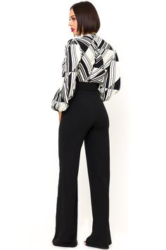 The Black and White Jumpsuit by Bella Chic is the total package, elegant, classic, and stunning! You’ll look completely irresistible in this one piece outfit. Go from career to cocktails in this long sleeve jumpsuit! This black and white jumpsuit starts with a v neck design and a fitted waist top that flows into relaxed wide leg pants, while a waist cinching belt completes this look! This jumpsuit is made of a stretch knit fabric that shapes and hugs your curves. The black and white jumpsuit is Elegant Long Sleeve Jumpsuits And Rompers For Evening, Elegant Long Sleeve Pantsuit For Night Out, Sleek Long Sleeve Formal Pantsuit, Chic Long Sleeve Pantsuit For Party, Elegant Black Pantsuit For Office Wear, Chic Long Sleeve Bodysuit For Night Out, Long Sleeve Jumpsuits And Rompers For Office, Chic Long Sleeve Pantsuit For Work, Elegant High Waist Bodysuit