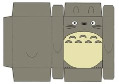 a paper box with an image of a totoro in the bottom and one eye open