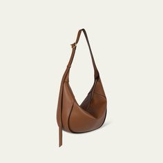 Wandler "Maggie" hobo bag in leather and zamak  Adjustable shoulder strap Zip top closure  Lining: Sueded microfiber Approx. 12.6"H x 13.8"W x 5.9"D Item Weight (Lbs.): 1.4 Professional cleaning recommended Made in Italy Luxury Leather Baguette Bag For Errands, Leather Shoulder Baguette Bag For Errands, Leather Baguette Shoulder Bag For Errands, Leather Crossbody Baguette Bag For Errands, Luxury Crossbody Hobo Bag For Errands, Luxury Leather Saddle Bag For Errands, Versatile Top Handle Hobo Bag For Business, Versatile Business Hobo Bag With Top Handle, Versatile Leather-lined Crossbody Hobo Bag