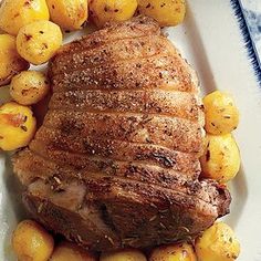 a plate with roast and potatoes on it