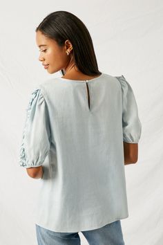 Womens Ruffle Blue Dress Shirt | Boho Clothing – Sophie & Hailee Spring Puff Sleeve Top With Ruffles And Relaxed Fit, Spring Relaxed Fit Puff Sleeve Top With Ruffles, Light Wash Fitted Ruffle Top, Spring Denim Top With Ruffles Short Sleeve, Spring Short Sleeve Denim Top With Ruffles, Spring Denim Top With Ruffles And Short Sleeves, Casual Ruffled Puff Sleeve Top For Brunch, Spring Light Wash Blouse With Ruffles, Casual Puff Sleeve Top With Ruffles For Brunch