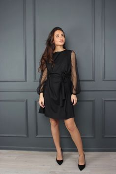 "Elegant black dress is perfect for every evening party. Puffy long organza sleeves make this dress aerial. It's made in a loose A-line silhouette with small buttons as a plank on the back. DINARA dress fits perfectly for every woman body shape and size. This kind of the dress hide all body imperfections. Just tie around the belt, to highlight the waistline and be sure you look amazing in this dress. Match it with black pumps with high or low heels and feel feminine and beautiful. DETAILS: - Boa Evening Midi Dress With Blouson Sleeves For Fall, Fall Evening Midi Dress With Blouson Sleeves, Party Midi Dress With Lantern Sleeves, Black Balloon Sleeve Dresses For Fall, Black Balloon Sleeve Dress For Fall, Chic Bishop Sleeve Long Sleeve Dress For Party, Elegant Midi Dress With Lantern Sleeves For Night Out, Elegant Lantern Sleeve Midi Dress For Night Out, Chic Long Sleeve Bishop Sleeve Dress For Party