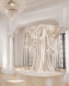 a large room with white curtains and chandelier