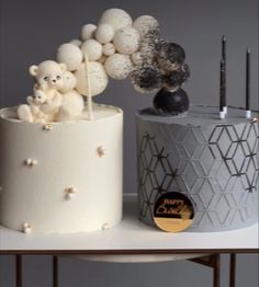 two cakes decorated with teddy bears and balloons