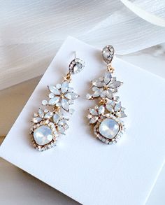 "Vintage opal Earrings Wedding Bridal Earrings Floral Crystal Rhinestone Opal Earrings Chandelier Statement earrings, Jewelry Gift for Her Add a touch of vintage glam to your look with these stunning opal earrings. Perfect for weddings, bridal events, or just a night out on the town. Floral Crystal Rhinestones: The intricate floral design of these earrings is embellished with sparkling crystal rhinestones that catch the light beautifully. Opal Stones: The opal stones add an elegant touch to the Glamorous White Chandelier Earrings With Sparkling Stones, White Crystal Earrings With Elegant Design For Party, White Cubic Zirconia Chandelier Earrings For Wedding, White Sparkling Crystal Bridal Earrings, Sparkling White Crystal Bridal Earrings, White Chandelier Earrings With Elegant Design For Party, White Elegant Chandelier Earrings For Party, White Crystal Bridal Earrings With Sparkling Stones, White Chandelier Earrings With Sparkling Stones