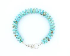 This large bead turquoise bracelet is a beautifully handcrafted piece, featuring high-quality AAA grade genuine 10mm blue-green Kingman turquoise wafer beads sourced from the renowned Kingman Turquoise mine in Arizona. The vibrant turquoise beads are paired with flat sterling silver spacers and findings, creating a striking contrast that enhances the natural beauty of the stone. For those who prefer a different finish, the bracelet is also available with gold-filled accents, offering a touch of Handmade Turquoise Heishi Beads Bracelets, Artisan Turquoise Beaded Bracelet With Gemstones, Turquoise Rondelle Hand-strung Beaded Bracelets, Handmade Turquoise Round Beaded Bracelets, Handmade Round Turquoise Beaded Bracelets, Artisan Turquoise Hand-strung Bracelets, Artisan Turquoise Beaded Bracelets With Spacer Beads, Artisan Turquoise Bracelets With Large Beads, Turquoise Bracelet Beads 8mm