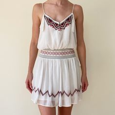 This Super Cute Chiffon Dress With Red And Blue Embroidery & Beading Is The Perfect Dress For Spring, Summer, & Pre-Fall. Wear With Sandals Or Boots! The Cinched Waist Is Super Flattering. The Tassels On The Straps Are The Cutest Touch. Very On Trend. Worn But In Great Condition! White Dresses With Geometric Embroidery For Summer, White Geometric Embroidery Dress For Summer, White Bohemian Embroidered Mini Dress, White Embellished Vacation Dress, Dress With Tassels, Embroidery Beading, Dress For Spring, Fall Wear, Blue Embroidery