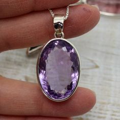 "Stunning Amethyst pendant cushion cut flat top oval shape light purple clear natural Amethyst stone set on 925 solid sterling silver unisex Amazing quality 925e sterling silver hypoallergenic and nickel free Dimensions Stone Only : 26 x 18 mm Length with silver bail : 40 mm (1.58\") Width : 19.3 mm (0.76\") Height : 10 mm Weight : 11.1 925 sterling Silver chain available starts at $10 USD from 16\" to 30\"" Faceted Oval Sterling Silver Gemstones, Faceted Oval Purple Jewelry, Oval Faceted Sterling Silver Gemstone, Purple Oval Sterling Silver Gemstones, Oval Amethyst Jewelry Gift, Oval Amethyst Jewelry With Polished Finish, Polished Oval Amethyst Jewelry, Oval Faceted Gemstones For Gifts, Oval Silver Amethyst Gemstones