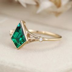 Step into the enchanting world of Art Deco with this stunning kite cut lab emerald ring. Meticulously crafted in 14k yellow gold, this ring embodies the elegance and glamour of the 1920s era. With its geometric lines, intricate details, and vibrant lab emerald, this masterpiece is destined to captivate hearts and turn heads. Elegant Marquise Emerald Ring, Elegant Asscher Cut Emerald Ring In 14k Gold, Elegant 14k Gold Asscher Cut Emerald Ring, Elegant Marquise Cut Emerald Ring, Elegant Green Trillion Cut Diamond Ring, Elegant Trillion Cut Emerald Ring, Elegant 14k Gold Marquise Cut Emerald Ring, Art Deco Emerald Ring As Gift, Art Deco Emerald Ring For Gift