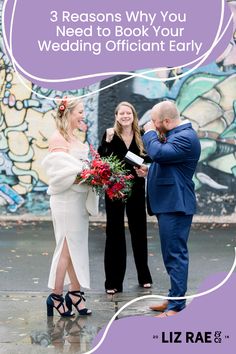 a man and woman standing next to each other in front of a wall with graffiti