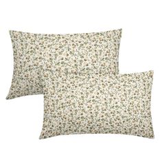 two pillows with floral print on them, one is white and the other is green