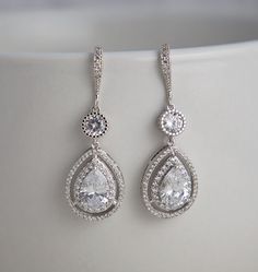 a pair of white gold and diamond earrings