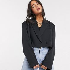 The Janice Cropped Blazer features a relaxed, cropped silhouette, V-neckline, notched lapels, drop sleeves, and double-breasted button closure. Lined Imported Crop Blazer Outfit, Cropped Blazer Outfit, Estilo Vanessa Hudgens, Cropped Jacket Outfit, Cropped Outfits, Black Blazer Outfit, Blazer Outfits Casual, Blazer Outfits For Women, Crop Top Outfits