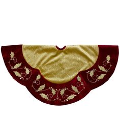 a red and gold bib with holly leaves on it