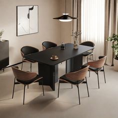 a dining room table and chairs in front of a window with potted plants on it