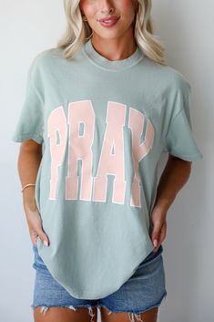 We love the message on the Sage Pray Tee! This comfy tee is designed with a soft and stretchy knit. It features a crew neckline, short sleeves, a relaxed fit, and the word "Pray" on the front. Style the Sage Pray Tee with your favorite denim and sneakers for a casual daytime look! Comfort Colors Soft + Stretchy Knit Fabrication "Pray" Graphic Crew Neckline Short Sleeves Relaxed Fit 100% Cotton Machine Wash Cold, Tumble Dry Low Model is 5'4" and wearing a Medium. For an Oversized Fit, We Recommen Sweaters Trendy, Sage Color, The Message, Large Bust, Comfy Tees, Small Bust, Comfort Colors, New Arrivals, Dress Up