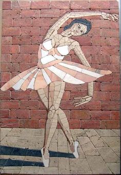 a painting on the side of a brick wall with a woman in a dress holding a ballerina