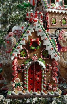 a group of gingerbread houses decorated with candy canes