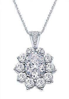 Stunning vintage design diamond pendant with a 0.90 ct. Tw. oval center diamond in a prong setting, surrounded by 0.60 ct. tw. round cut diamonds in a prong setting and smaller cluster diamonds on the top of the pendant. Graded as SI Clarity and G-H Color. Includes Free 16 inch gold chain. Handcrafted in your choice of 14k Gold, 18k Gold, or Platinum 950 setting. We also offer a 1-Year Layaway program. You can reach us at 1-888-967-5353 to speak to one of our jewelry specialist. Halo Pendant, Oval Cut Diamond, Diamond Halo, Conflict Free Diamonds, Round Cut Diamond, Halo Diamond, Diamond Pendant, Oval Cut, Prong Setting