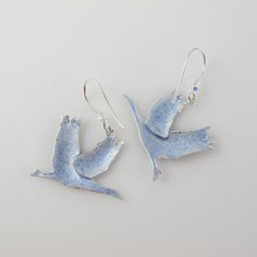 For lovers of Sandhill Cranes we offer this pair of fun yet fashionable earrings, crafted of sterling silver and adorned in cloisonné enamel. The Birds dangle from a French hook that has a Swarovski crystal attached for added interest and are lightweight and well detailed. Each earring is 1.25 inches in height from hook to belly and is 1 inch wide. They are new, in excellent condition, and marked 925 on the back although the enamel makes it hard to see. Be sure to take a peek at the matching bro Silver Enamel Earrings For Anniversary, Crane Earrings, Sandhill Cranes, Sandhill Crane, Peacock Ring, Fashionable Earrings, Spring Birds, Peridot Stone, Bird Jewelry