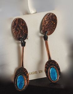 "These beautiful Vintage Copper and Blue earrings Made in Spain are a great addition to any vintage collection. On original card. Clip on. They measure 2 1/2\" long and 5/8\" wide. These can be made into pierced upon request!" Vintage Blue Dangle Jewelry, Vintage Patina Earrings, Vintage Blue Drop Earrings Jewelry, Vintage Blue Drop Earrings, Copper And Blue, Face Brooch, Original Card, Star Ring, Coin Necklace