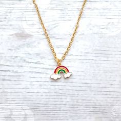 Super cute enamel rainbow charm necklace perfect for any rainbow lover. Great little birthday for family or friends. Would go perfect with matching items which can be found in my store. CHAIN LENGTH: *14inches perfect for children  *16inches perfect for children *18inches *20inches *22inches MARTERIALS: Chain, findings and charms and all gold plated *The enamel rainbow charm measures approximately 2cms long. * green, yellow, red * red, yellow, purple *These can also be personalised with initial charms which can be picked from the menu. The initial charms are gold plated and measure 1cm. ☆☆The necklace comes presented in a gift bag but boxes and gift wrapping can also be purchased from my store.☆☆ If you have any questions or custom orders please feel free to message me. Adjustable Rainbow Charm Necklaces Gift, Multicolor Hypoallergenic Necklace As A Gift, Playful Jewelry With Adjustable Chain For Gifts, Multicolor Hypoallergenic Necklace For Gift, Hypoallergenic Multicolor Necklace Perfect As Gift, Hypoallergenic Multicolor Necklace For Gift, Playful Rainbow Charm Necklaces For Gifts, Playful Rainbow Charm Necklace For Gift, Playful Rainbow Charm Necklace As Gift