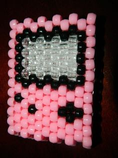 a pink and black beaded cell phone case