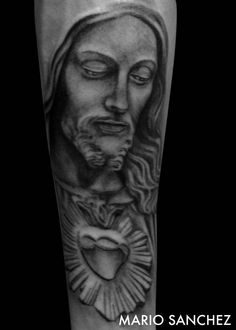 a black and white photo of a jesus with his eyes closed, on the leg