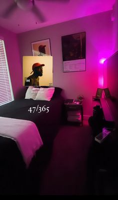 a bed room with a neatly made bed and purple lighting