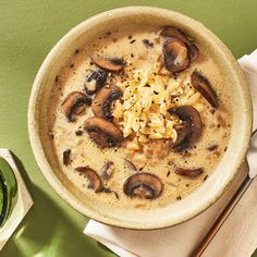 a bowl of soup with mushrooms and cheese