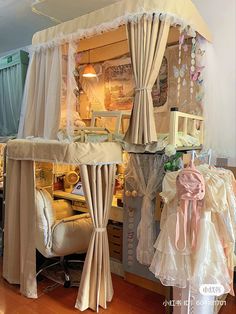 a doll house with curtains and furniture inside