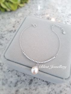 Our Bracelet Is Designed With White Freshwater Pearl And 925 Sterling Silver. You Can Wear It All Day Long. *Jewelry : Pearl Bracelet *Pearl Type : Freshwater Pearl *Pearl Grade : AAA+ *Pearl Luster : High *Pearl Body : Clean *Pearl Shape : Drop/Round *Pearl Nacre : All (100% nacre)  *Bracelet Length : 7-7.5 Inches  *Pearl Color : White/ Pink/Gray/ Black *Pearl Size : 8-9mm *Clasp : 925 Sterling Silver *Nice Jewelry Box Wrap *Pearl Jewelry can easily be made with different size or color upon request. Thanks For Choosing Blest Jewellery :) Elegant Sterling Silver Bracelet With Pearl Charm, Sterling Silver Bracelet With Pearl Drop, Sterling Silver Pearl Charm Bracelet For Anniversary, Elegant Sterling Silver Bracelet With Pearl Charm Gift, Sterling Silver Bracelet With Pearl Drop In Silver, Silver Sterling Silver Bracelet With Pearl Drop, Sterling Silver Pearl Drop Bracelet For Anniversary, White Gold Pearl Drop Bracelet As Gift, Anniversary Sterling Silver Pearl Drop Bracelet