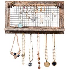 a wooden rack with many necklaces hanging from it