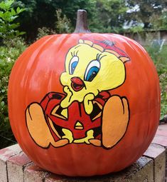 a large pumpkin with a cartoon character painted on it