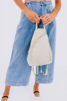 Carry all your essentials in style with the FREE PEOPLE - Soho Convertible Bag. This leather tote bag is the perfect versatile accessory for any outfit, giving you both practicality and fashion in one. Stay organized and effortlessly chic with this must-have bag. Versatile Beige Hobo Bag For Everyday Use, Eco-friendly Hobo Bag With Leather Handles, Casual Leather Backpack For On-the-go, Casual Khaki Hobo Bag For Everyday, Casual Everyday Khaki Hobo Bag, Versatile Canvas Hobo Bag For On-the-go, Versatile Everyday Canvas Bags, Cream Hobo Bag With Zipper For Travel, Cream Hobo Bag For Travel With Zipper Closure