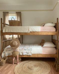 two wooden bunk beds in a bedroom next to each other