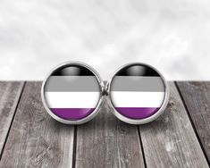 Asexual Flag Stud Earrings  LGBTQ Jewelry Asexual Posts  Post Earrings: * Stainless steel will never tarnish  * The finish is stainless steel and will never wear off * 12 mm or a little less than 1/2 of an inch in diameter * all of our jewelry is 100% waterproof * graphic treated with resin and covered with a crystal clear glass cabochon * Boxed, ready to ship and for gift giving! More Asexual items here: https://www.etsy.com/shop/ButtonRepublic?ref=seller-platform-mcnav&search_query=asexual  po Lgbtq Jewelry, Asexual Flag, Bisexual Flag, Lesbian Flag, Jewelry Earrings Studs, Buttons Pinback, Crystal Clear, Post Earrings, Mirrored Sunglasses