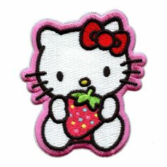 a hello kitty patch with a strawberry in it's hand and a bow on its head